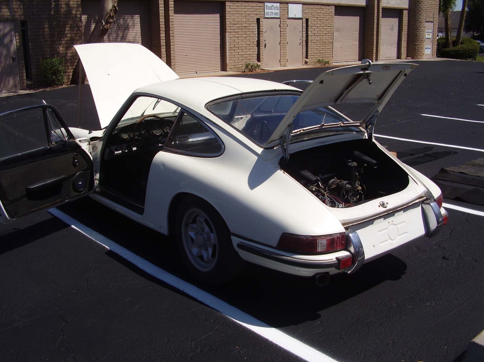 The donor 912 as found — rear three-quarter, engine lid up