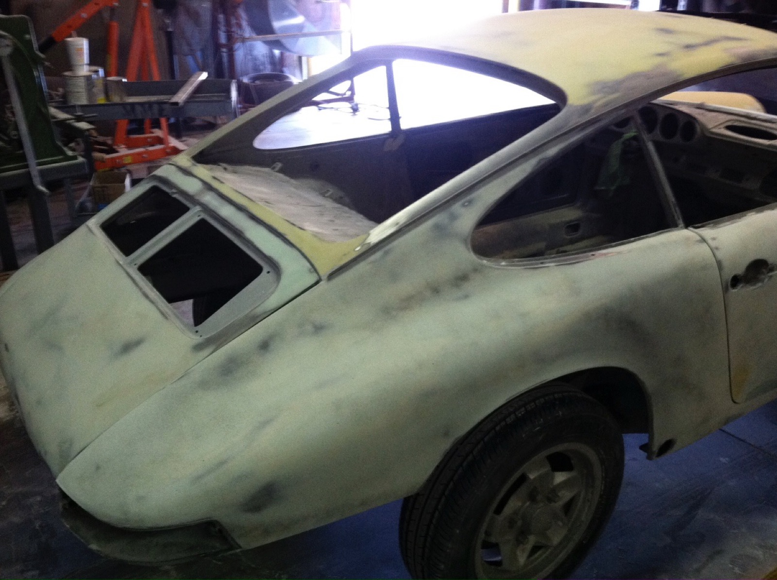 The 912 stripped and sanded back in the bodyshop — the problem revealed