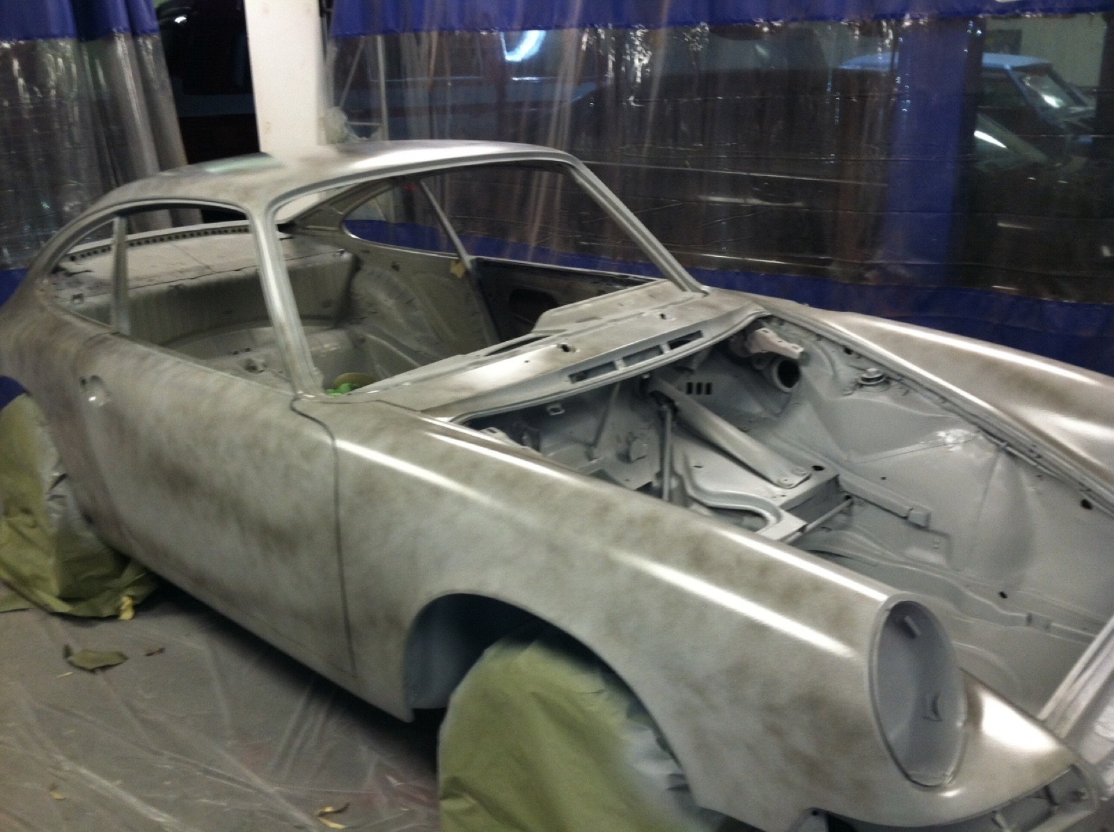 The straightened 912 shell in primer, in the spray booth