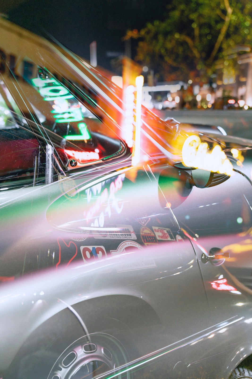 The finished ElectroPorsche at night, streaked with neon light