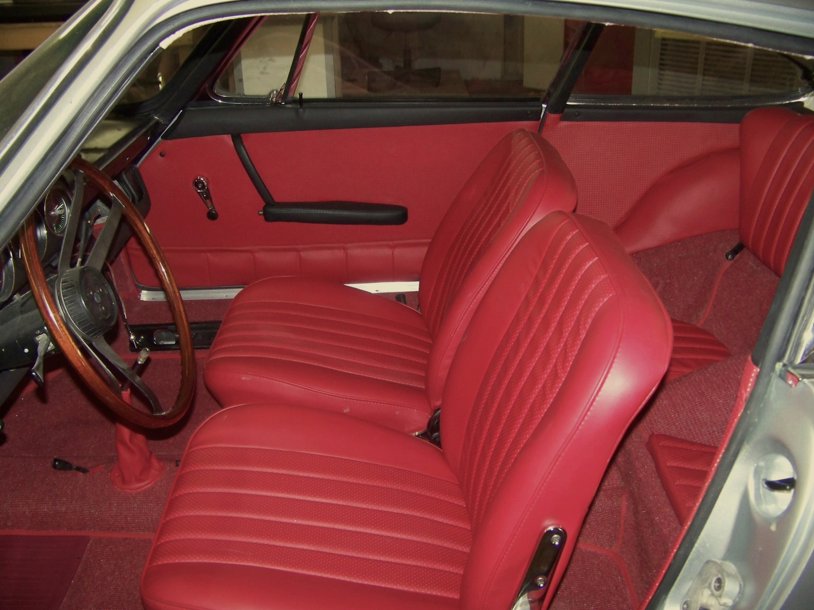 Red leather front seats and door panels