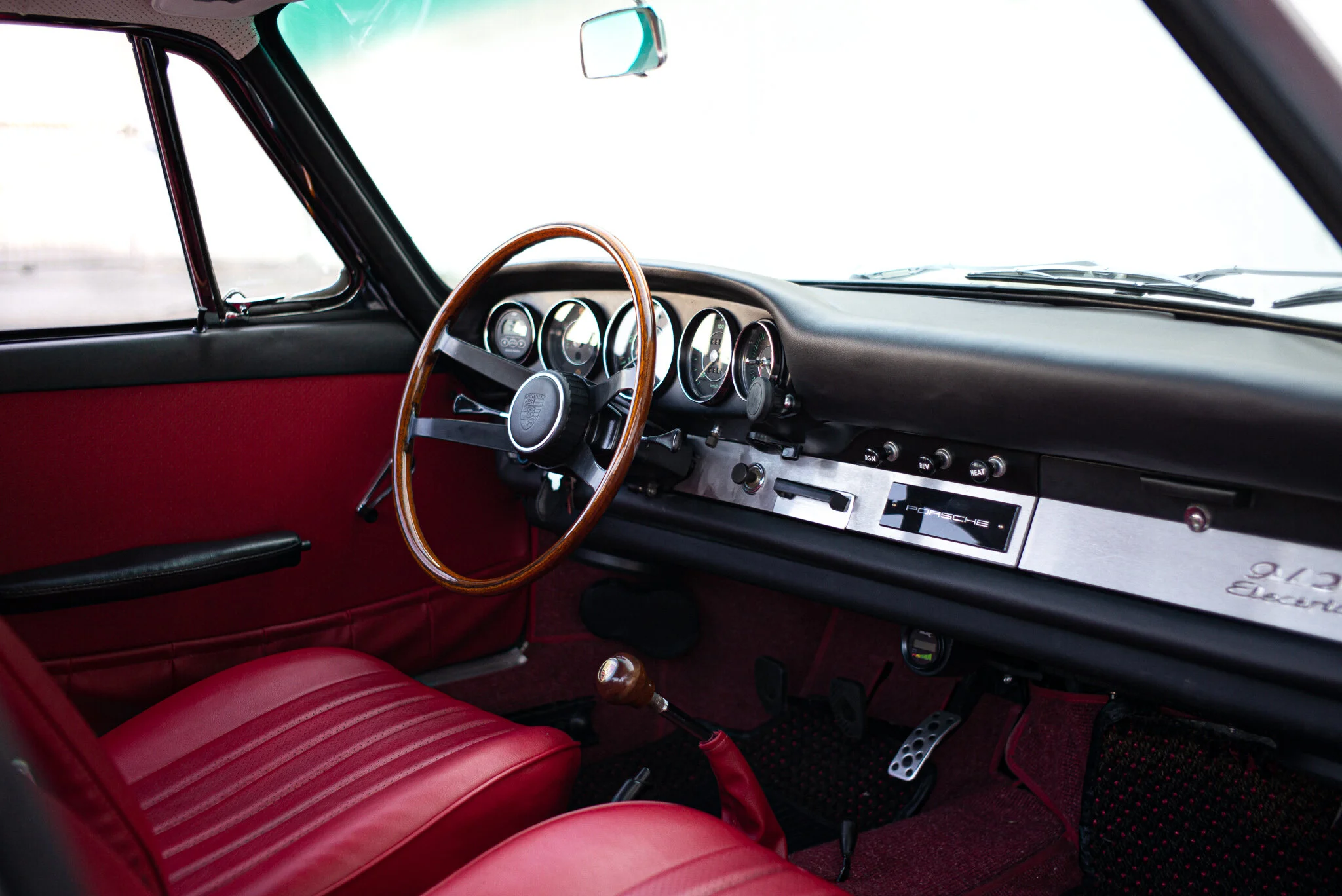 Red leather interior with restored wooden steering wheel — ElectroPorsche