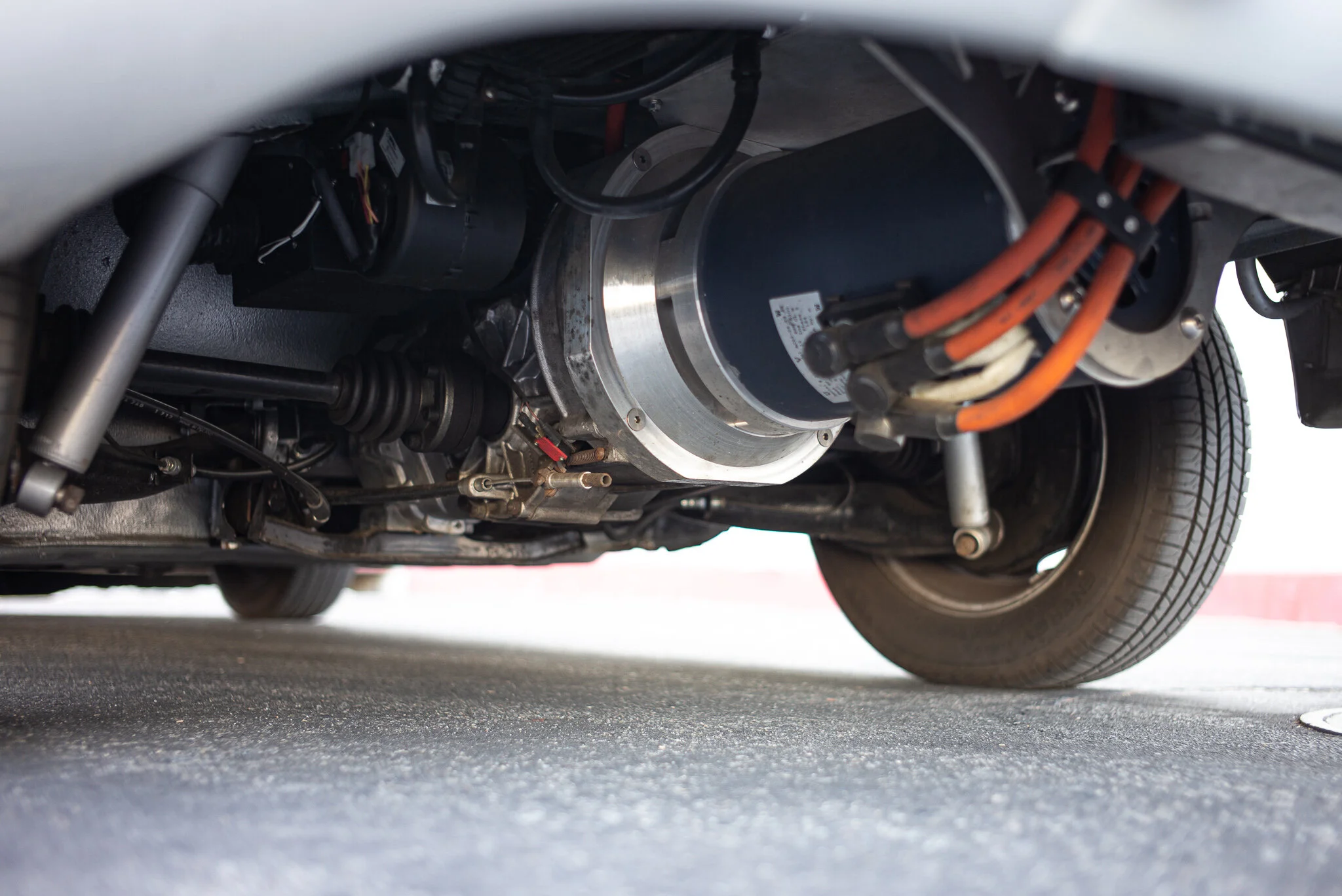 Electric motor under the 912 — orange HV cables visible